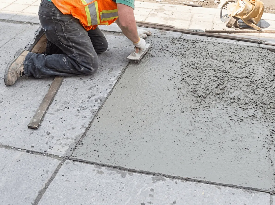 Professional repairing a concrete floor in Albany, NY